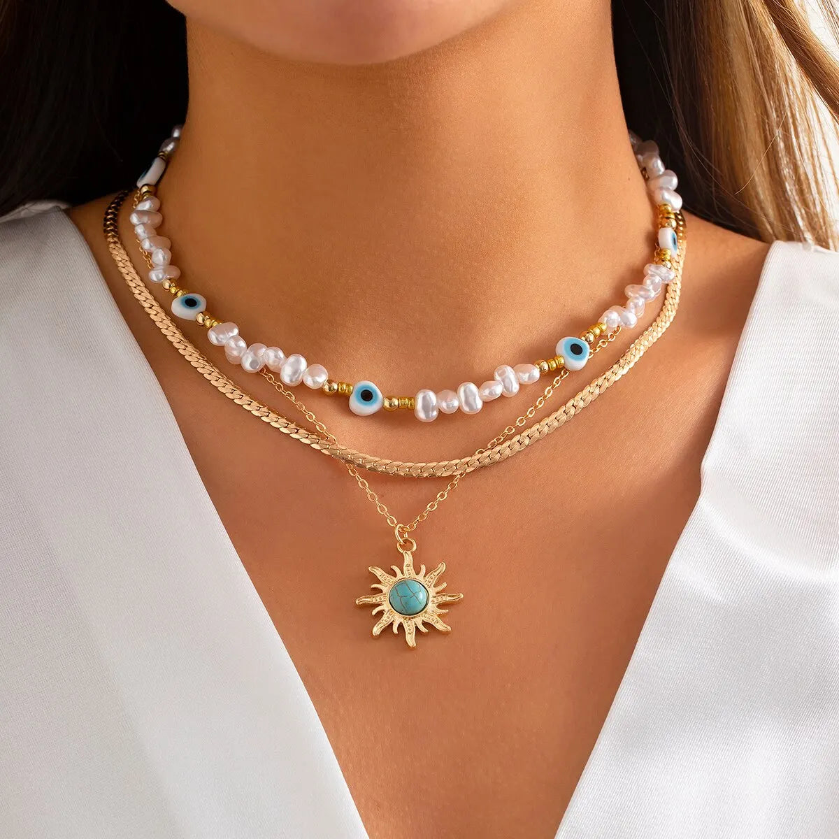 Set di Collane a Strati Parel & Occhio Maligno – Ciondolo Sole Boho