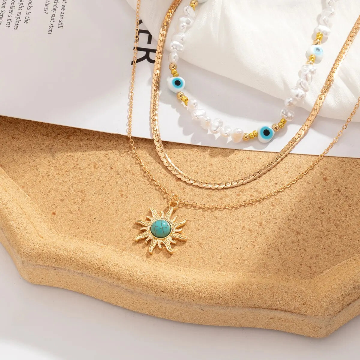 Set di Collane a Strati Parel & Occhio Maligno – Ciondolo Sole Boho