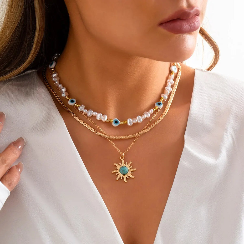 Set di Collane a Strati Parel & Occhio Maligno – Ciondolo Sole Boho